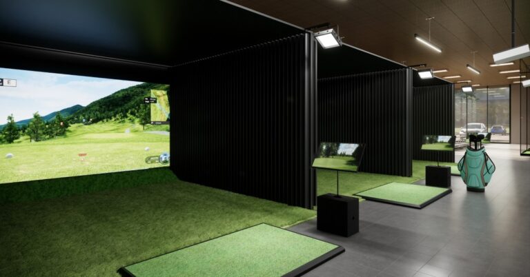 The interior of a golf simulator franchise, including three separate golfing simulators ready for customer use.
